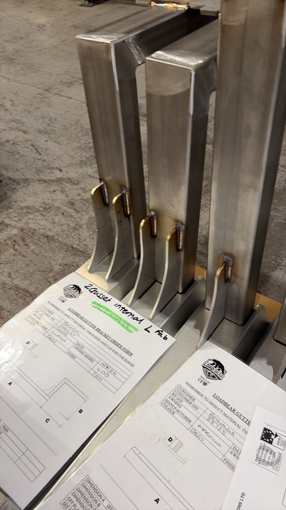 Custom LoadBear gutter awning brackets with order forms before colour coating