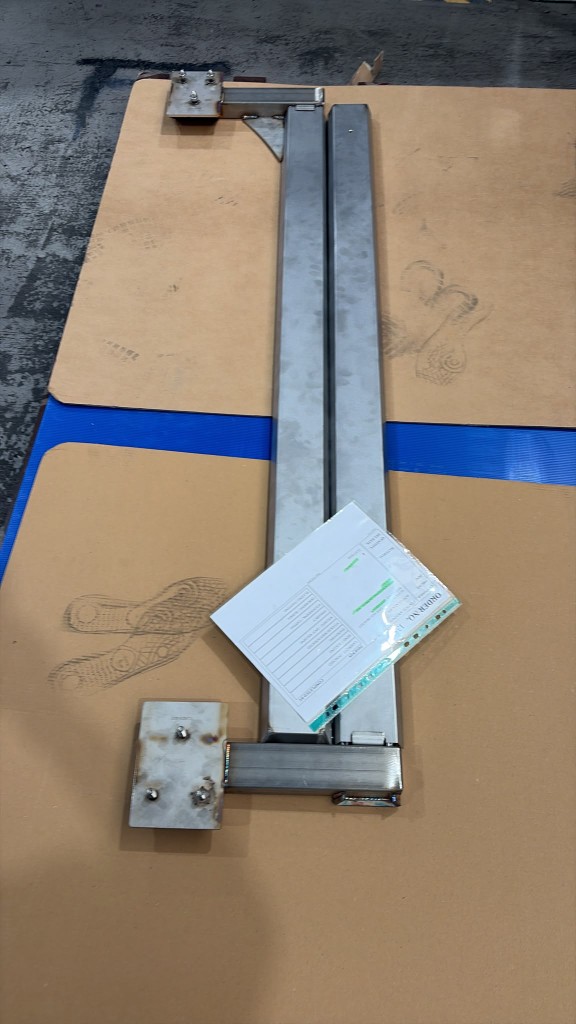 Custom heavy-duty LoadBear awning brackets welded and ready for powder coating