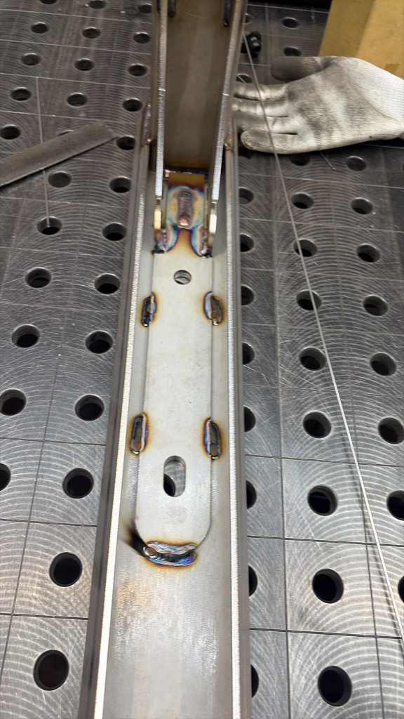 Additional internal reinforcement plate stitch-welded inside an Extreme Gutter Bracket channel