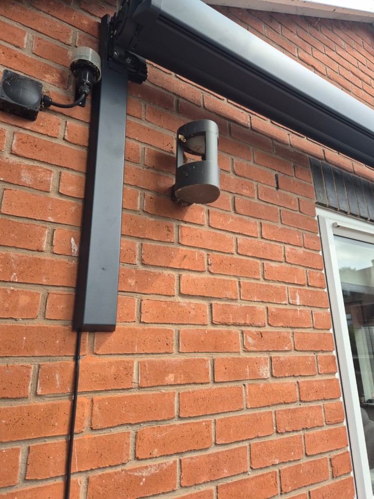 Anthracite LoadBear awning bracket with adjustable mounting plate before installation