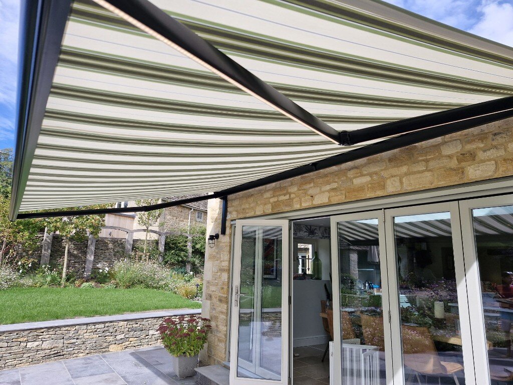 Under-arm view of a BASE awning with LED strip on LoadBear brackets